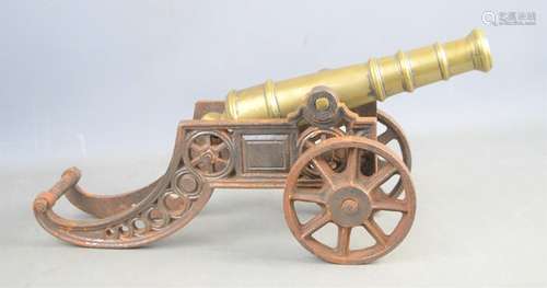 A 19th century signal cannon in a cast iron frame