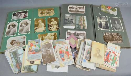 Two albums of Edwardian and later postcards to include some ...