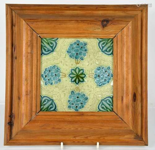 A Minton tile in later pine frame.