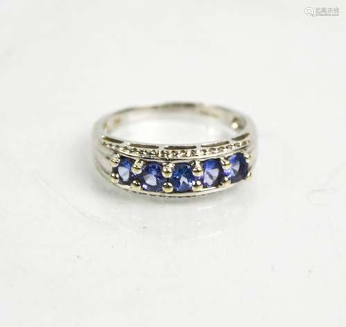 A 9ct white gold and tanzanite ring, size P1/2, 3.26g