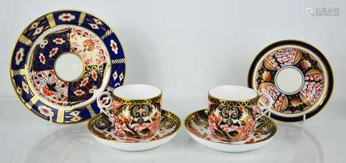 A pair of Royal Crown Derby cups and saucers and dish, toget...