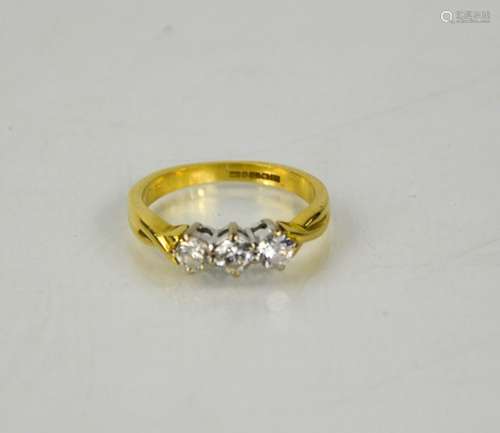 An 18ct yellow gold vintage three stone diamond trilogy ring...