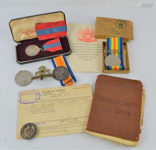 A WWI and WWII medal together with a Imperial service medal,...