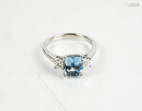 An 18ct white gold, aquamarine and diamond three stone ring,...