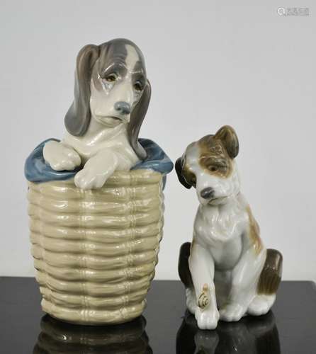 A Lladro porcelain puppy in a basket, and another with a sna...