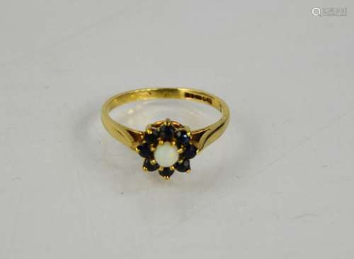 A 9ct gold sapphire and opal ring, size J, 1.5g.