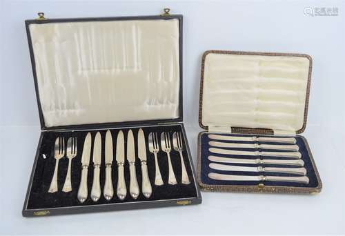 A cased set of silver handled butter knives together with a ...