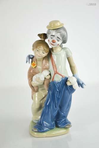 A Lladro porcelain clown and girls with puppies, 7686, 23cm ...