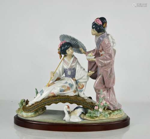 A Lladro porcelain figure group titled Springtime in Japan, ...