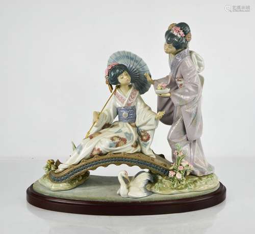 A Lladro porcelain figure group titled Springtime in Japan, ...