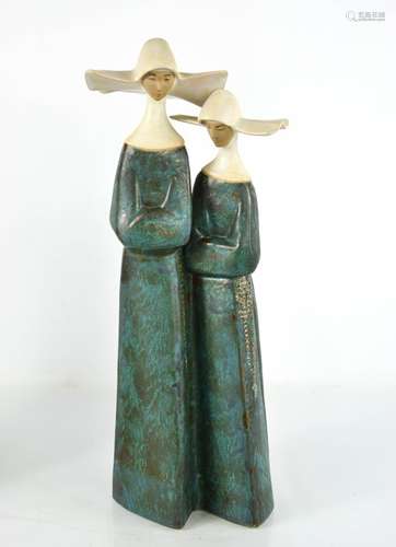 A Lladro porcelain pair of nuns, number 2075, 33cm high.