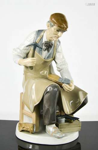 A Lladro porcelain figurine titled The Cobbler, number 4853,...