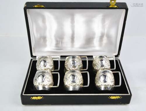 A set of six Sterling silver miniature tankards, each emboss...