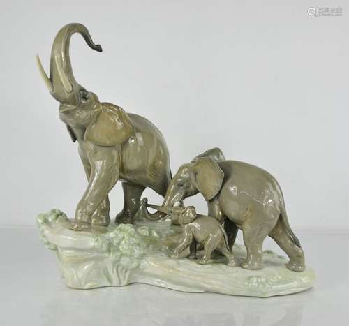 A Lladro porcelain group titled Elephants Walking, 37cm high...