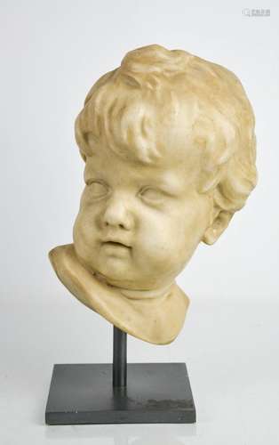 A 17th century style cherub head, raised on a metal stand.