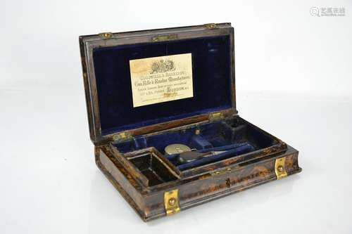 A 19th century pistol case, in simulated burr coromandel, cl...