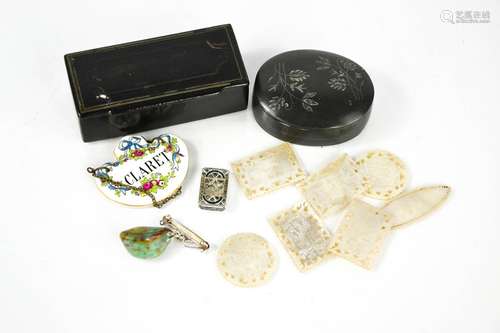 A Victorian papier mache snuff box, claret bottle tag, mothe...