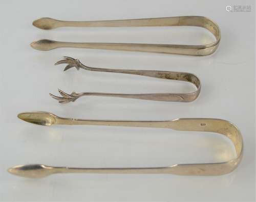 Two Georgian silver sugar tongs together with a later exampl...