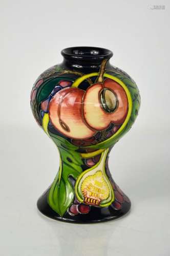 A Moorcroft vase, in the Queens Choice pattern designed by E...