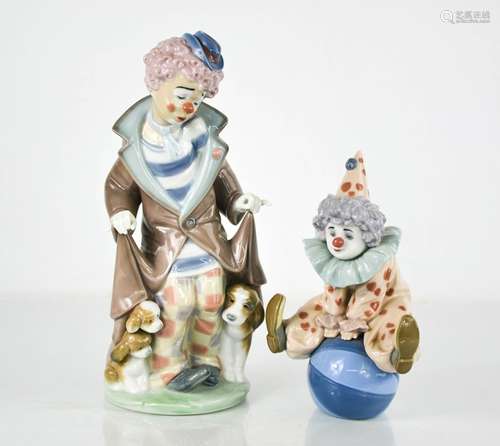 Two Lladro clowns, one with puppies 5901, and one seated on ...