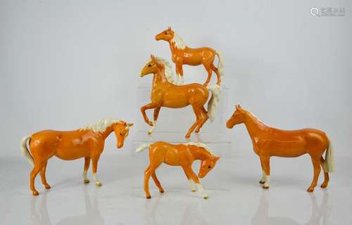 Five Beswick porcelain Palomino horses in various poses, tal...