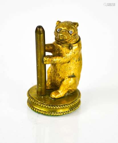 A gilt metal match holder in the form of a bear with hinged ...