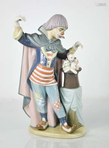 A Lladro clown, standing beside a magic hat with kittens, 58...