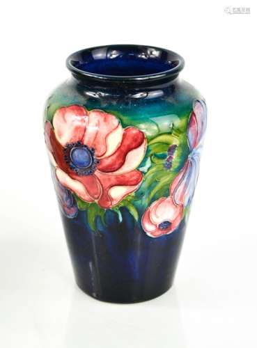 A Moorcroft vase in the Poppy pattern, 13cm high.