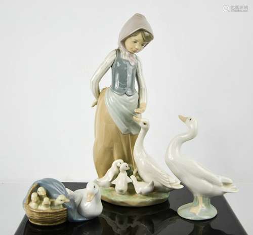 Three Lladro porcelain figurines: Girl Feeding Ducks, Duck, ...