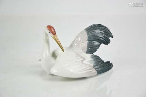 A Lladro porcelain Fluttering Crane, signed to the base Llad...