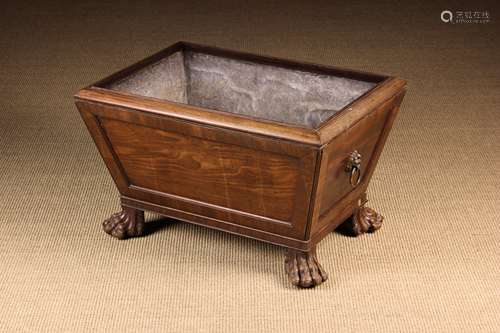 An Irish Regency Mahogany Wine Cooler of tapering rectangula...