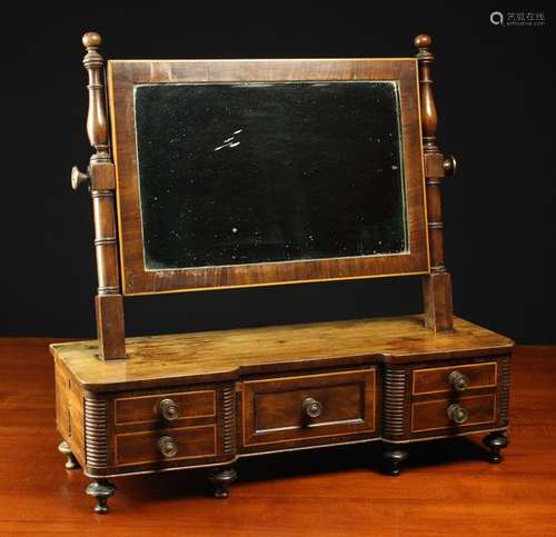 A George IV Inlaid Mahogany Dressing Mirror edged in boxwood...