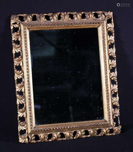 A Small Rectangular Wall Mirror in a decorative 19th Century...