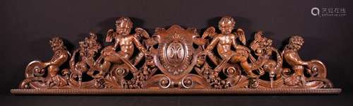 An Italian Baroque Carved Walnut Pediment Rail,