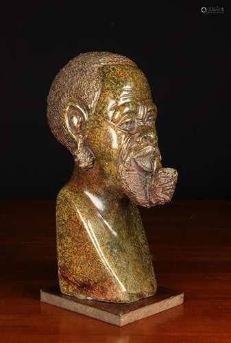 A Fine Carved Brown Granite Head of an African Man Smoking a...