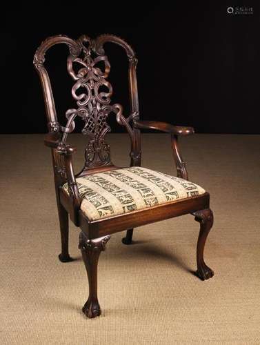 A Chippendale Style Carved Mahogany Armchair.