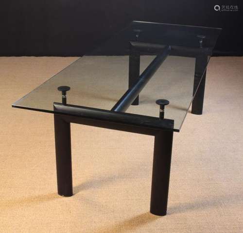 A Large Glass Topped Dining Table on a black metal base, 28