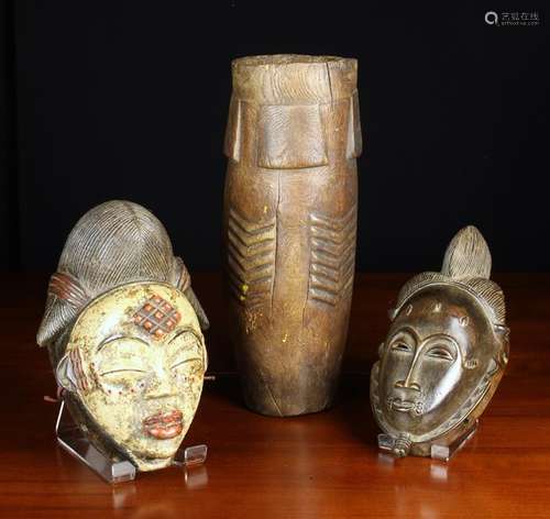 Two African Tribal Masks: One with red and white paint.