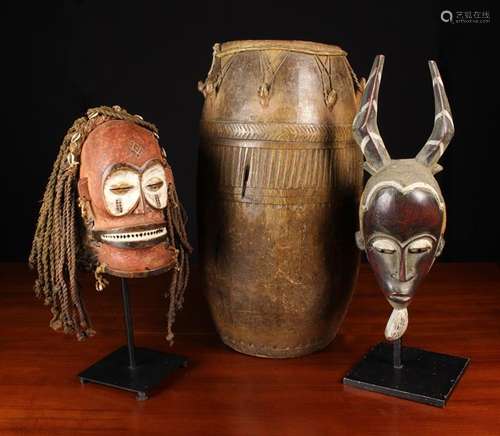 Two African Wooden Tribal Masks painted with pigment decorat...