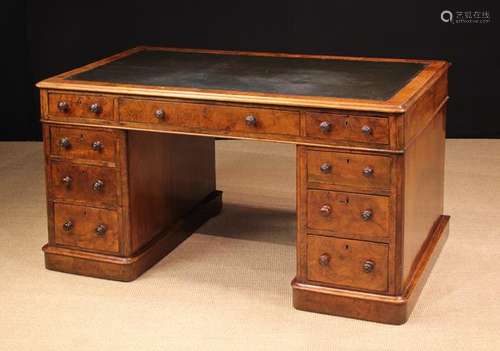 A Victorian Figured Walnut Pedestal Desk.