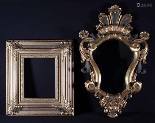 A Cartouche-shaped Wall Mirror in a carved,