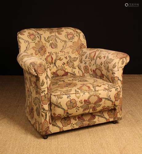 A Small Upholstered Tub Armchair covered in a foliate woven ...