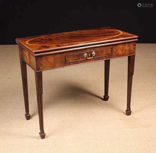 A 19th Century Inlaid Mahogany Fold Over Table.