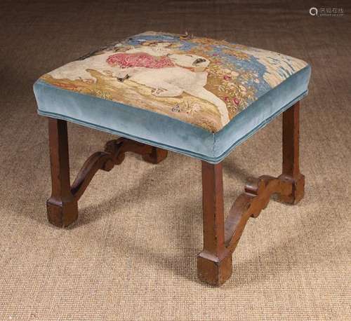 A 19th Century Upholstered Stool.