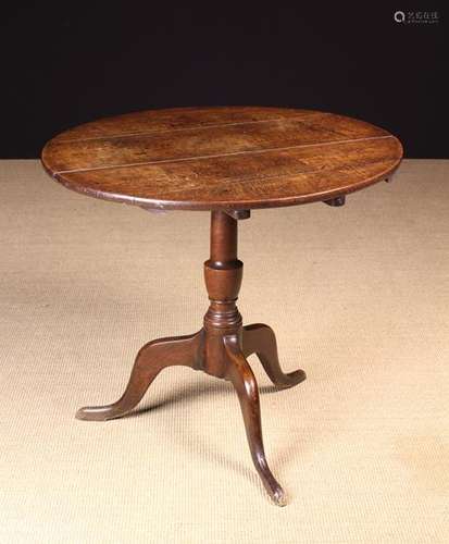 A 19th Century Oak Tilt top Tripod Table.