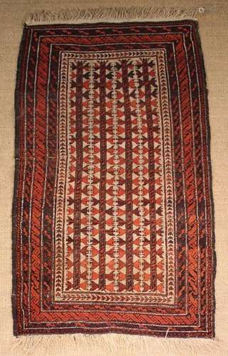 A Caucasian Rug woven in claret, burgundy, beige,