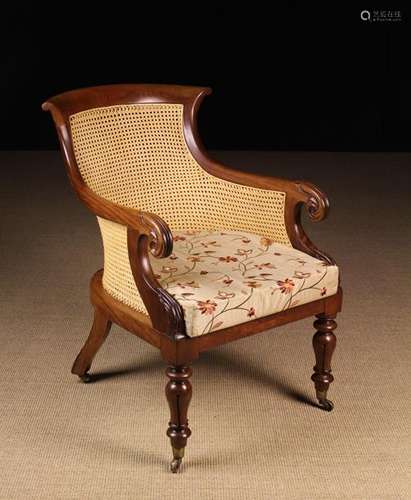 A William IV Mahogany Bergère Armchair.