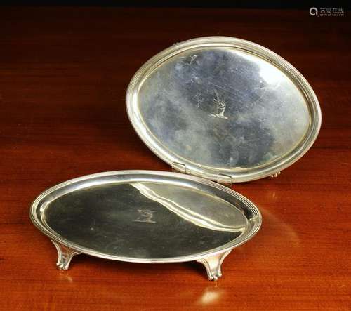 A Pair of Georgian Silver Salvers of Neo-classical design,