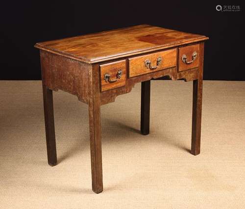 A George III Mahogany Lowboy.