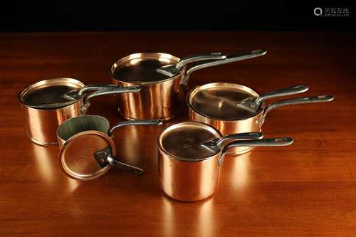 Five Graduated 19th Century Copper Sauce Pans with flat dish...